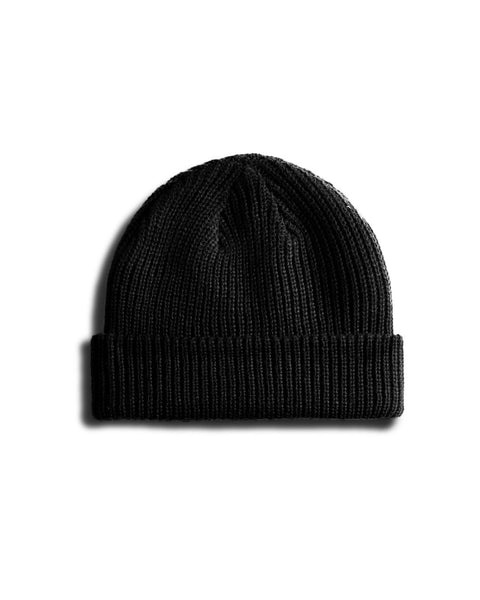 Back of black Beanie over white background. 