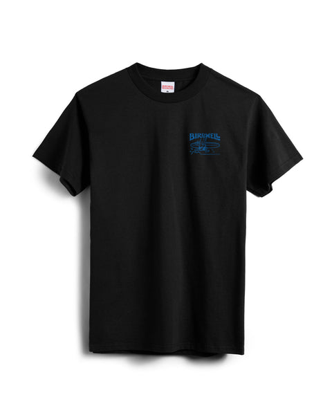 The Bros T-Shirt - Black is a 100% cotton, heavyweight short-sleeve tee with a classic crew neckline. Displayed on a white background, it features a small blue Birdwell logo and graphic on the left chest area.